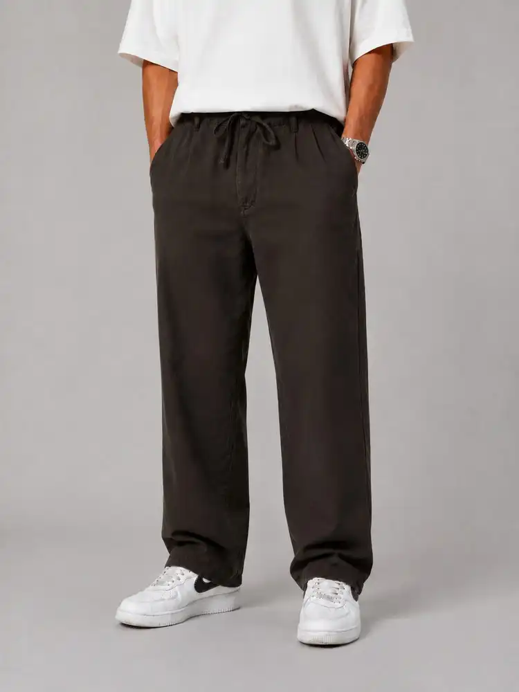 Baggy-pants-Lyocell-fabric-plain-brown-color-suitable-for-the-season-heroshoop.webp شلوار پارچه ای بگ استایل / پارچه لیوسل رنگ قهوه ای ساده / مناسب فصل - Image 1