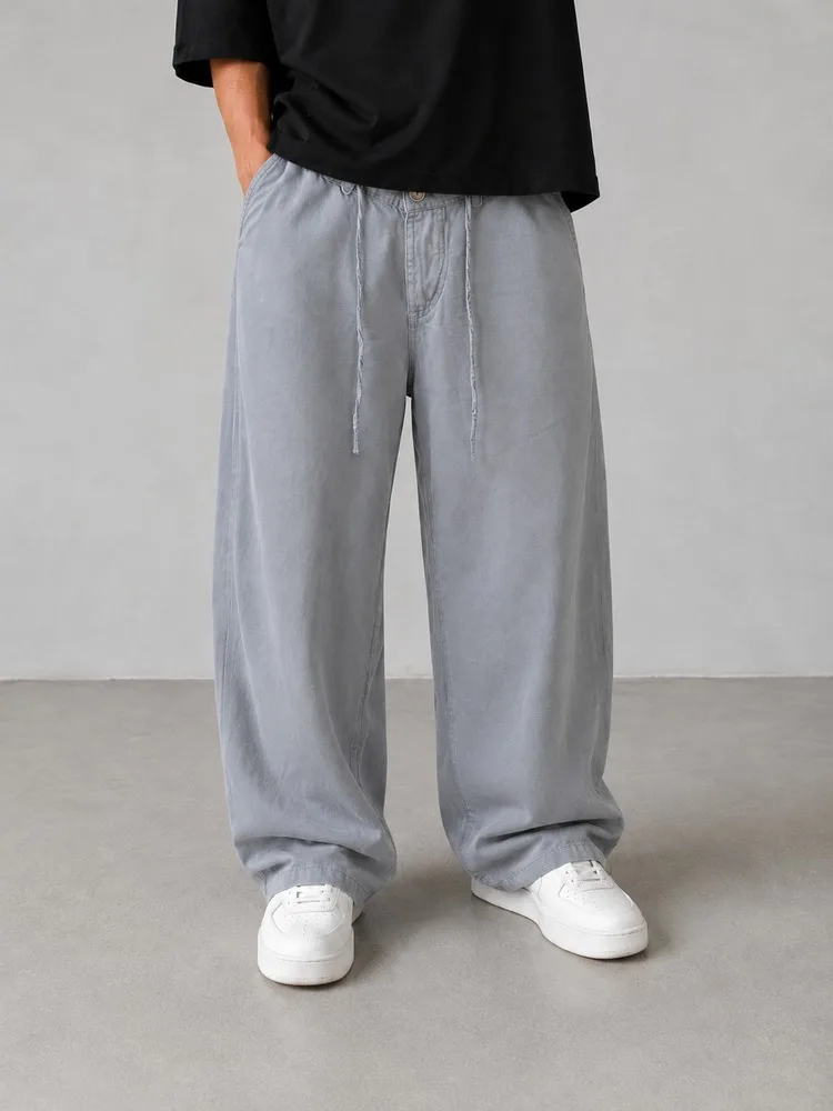 Baggy-style-fabric-pants-lyocell-fabric-premium-gray-color-suitable-for-the-season-heroshoop.webp شلوار پارچه ای بگ استایل / پارچه لیوسل رنگ طوسی درجه یک / مناسب فصل 4007 - Image 1