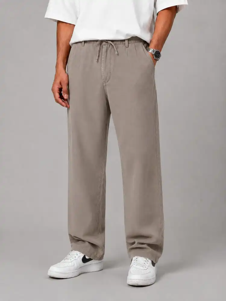 Baggy-style-fabric-pants-natural-lyocell-fabric-cream-color-1-first-class-fabric-heroshoop.webp شلوار پارچه ای بگ استایل ساده / پارچه طبیعی لیوسل / رنگ کرمی 1 / پارچه درجه یک - Image 1