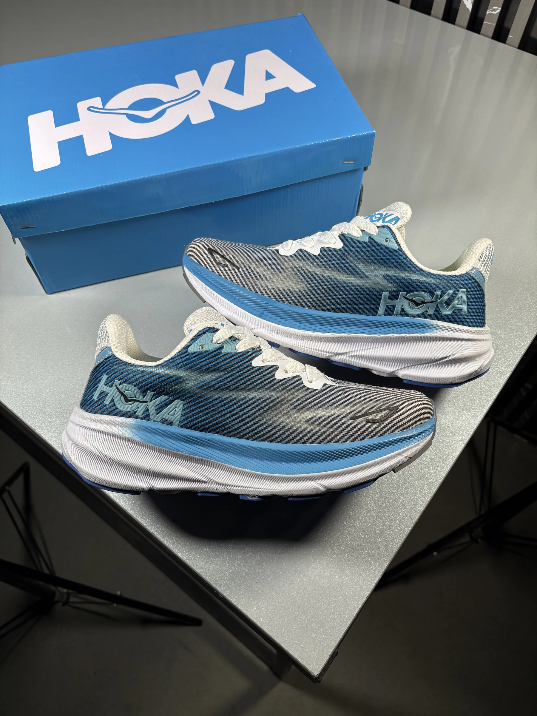 Hoka-model-comfortable-running-shoes-blue-white-gray-heroshoop.webp کتونی رانینگ راحتی مدل هوکا / آبی سفید طوسی / کد 2126 - Image 1