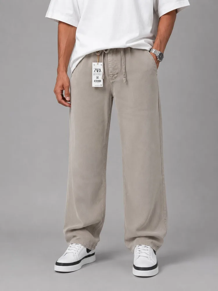 Men-baggy-style-fabric-pants-Khaki-lyocell-fabric-heroshoop.webp شلوار پارچه ای مردانه قواره بگ استایل / پارچه لیوسل / خاکی - Image 1