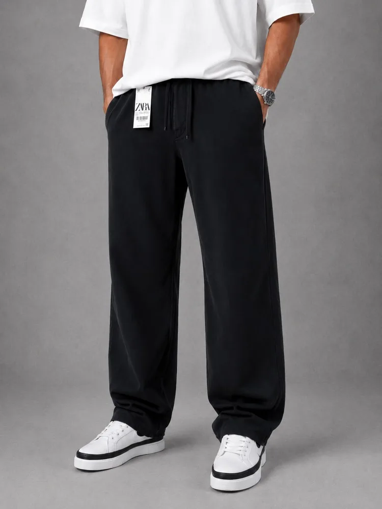 Men-baggy-style-fabric-pants-Lyocell-fabric-black-color-heroshoop.webp شلوار پارچه ای مردانه قواره بگ استایل / پارچه لیوسل / رنگ مشکی - Image 1