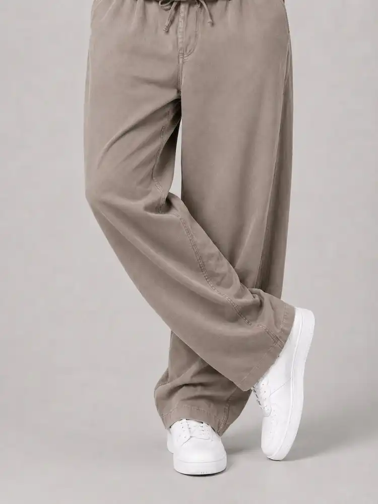 Natural-Lyocell-fabric-half-bag-pants-long-length-108-cream-1-color-heroshoop.webp شلوار پارچه ای نیم بگ پارچه لایوسل طبیعی / قد بلند ۱۰۸ / رنگ کرمی1 ساده - Image 1