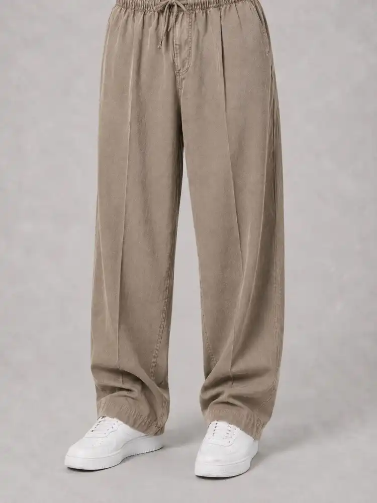 Natural-Lyocell-fabric-half-bag-pants-long-length-108-cream-1-color-with-cocoon-heroshoop.webp شلوار پارچه ای نیم بگ پارچه لایوسل طبیعی / قد بلند ۱۰۸ / رنگ کرمی1 پیله دار - Image 1