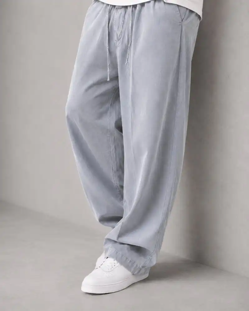 Natural-Lyocell-fabric-half-bag-pants-long-length-108-gray-color-heroshoop.webp شلوار پارچه ای نیم بگ پارچه لایوسل طبیعی / قد بلند ۱۰۸ / رنگ طوسی ساده - Image 1