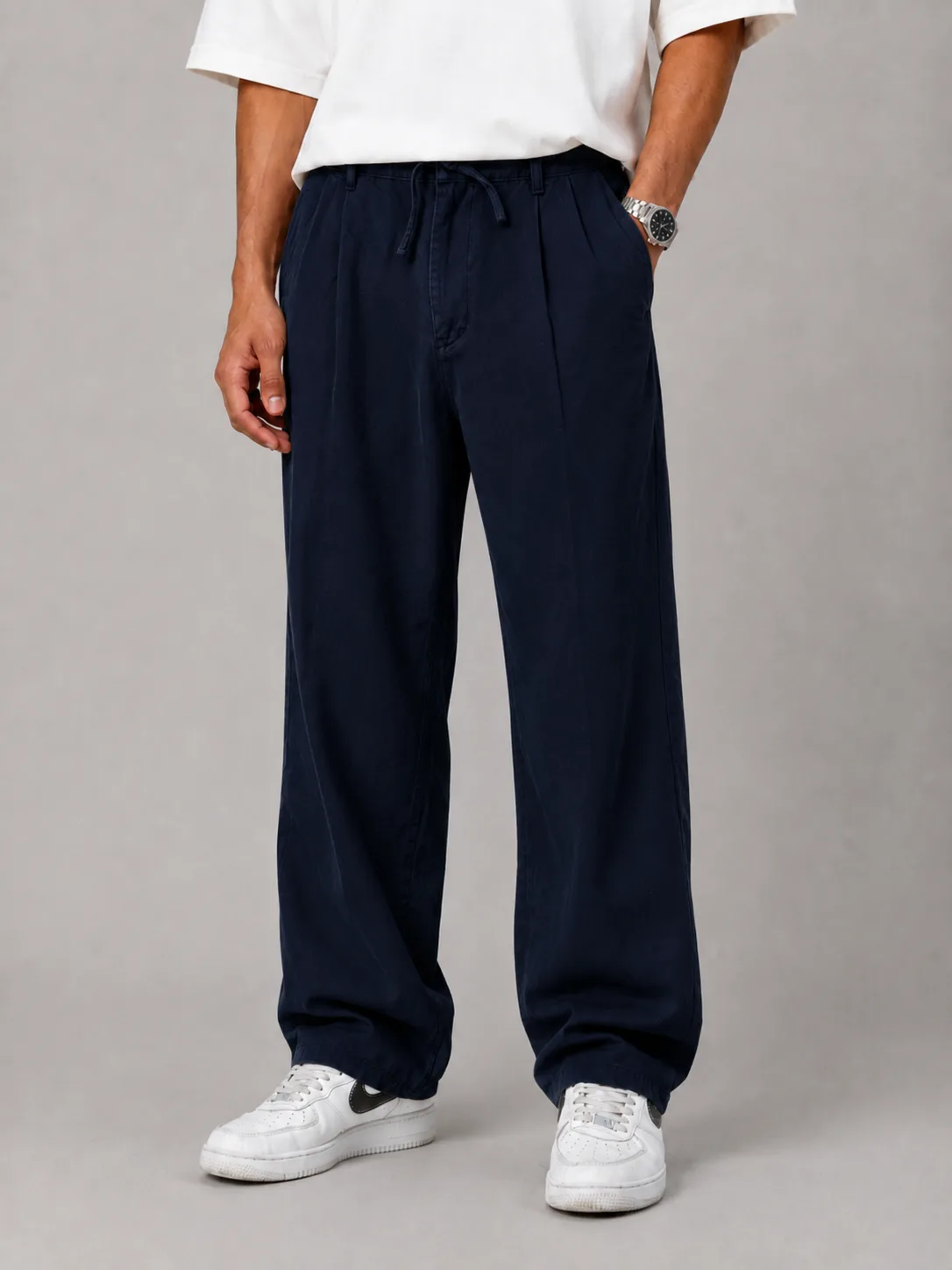 Navy-blue-lyocell-fabric-baggy-pants-with-cocoon-heroshoop.webp شلوار پارچه ای بگ استایل / پارچه لیوسل رنگ سرمه ای پیله دار - Image 1