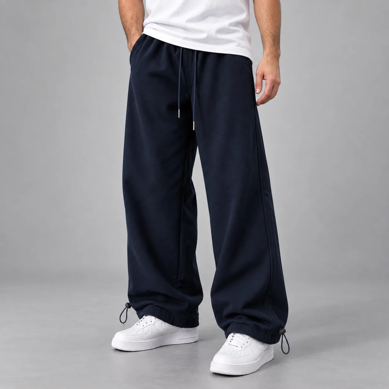 Baggy-style joggers Length 110 cm Elastic waistband Adjustable cuffs with toggles Color Navy blue Code 8005 3-thread cotton French terry www.heroshoop.com view 1 Baggy-style-joggers-Length-110-cm-Elastic-waistband-Adjustable-cuffs-with-toggles-Color-Navy-blue-Code-8005-3-thread-cotton-French-terry-www.heroshoop.com-view-1.webp